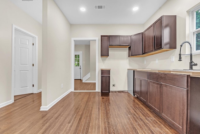 510 Leath St, Memphis, TN 38105 - kitchen with dark wood-style flooring, dark brown cabinets, light countertops, baseboards, and recessed lighting