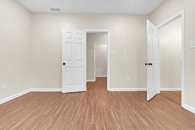 510 Leath St, Memphis, TN 38105 - unfurnished bedroom featuring wood finished floors and baseboards