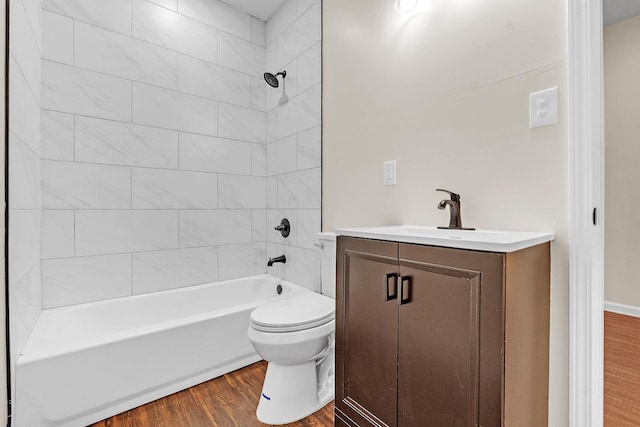 510 Leath St, Memphis, TN 38105 - bathroom featuring wood finished floors, toilet, vanity, and washtub / shower combination