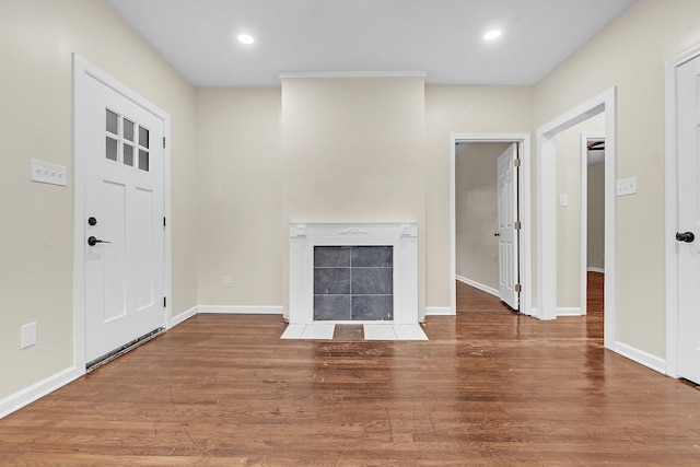 510 Leath St, Memphis, TN 38105 - unfurnished living room featuring a tiled fireplace, wood finished floors, baseboards, and recessed lighting