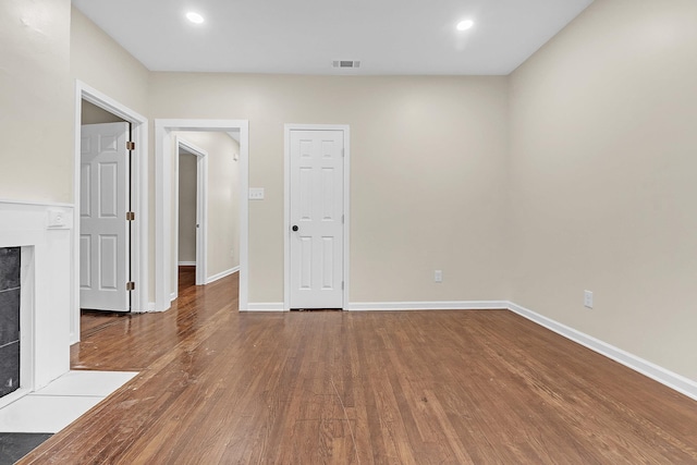 510 Leath St, Memphis, TN 38105 - spare room with a fireplace, wood finished floors, baseboards, and recessed lighting