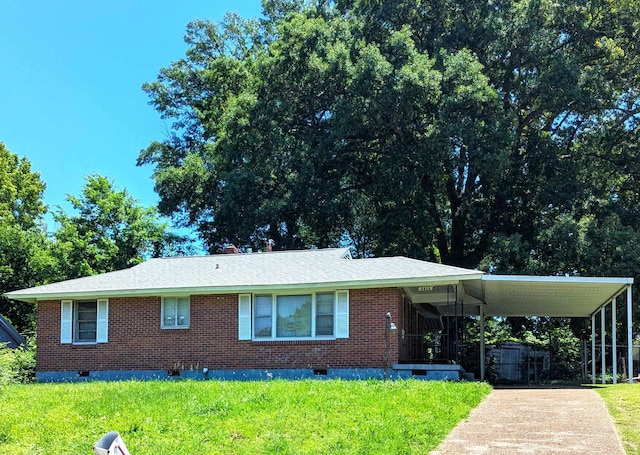 3314 Adair Dr, Memphis, TN 38127 - view of front of property featuring crawl space, a front lawn, brick siding, driveway, and a carport