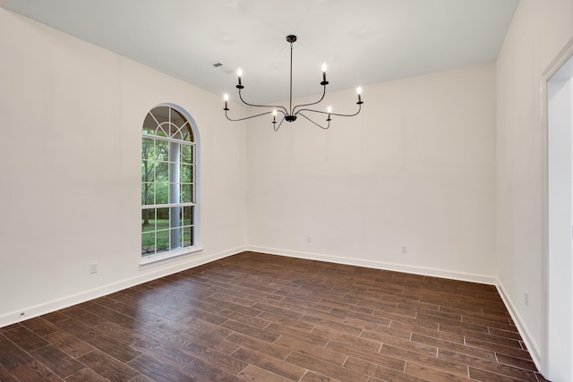 95 Hancock Cv, Eads, TN 38028 - unfurnished room featuring a chandelier, dark wood finished floors, and baseboards