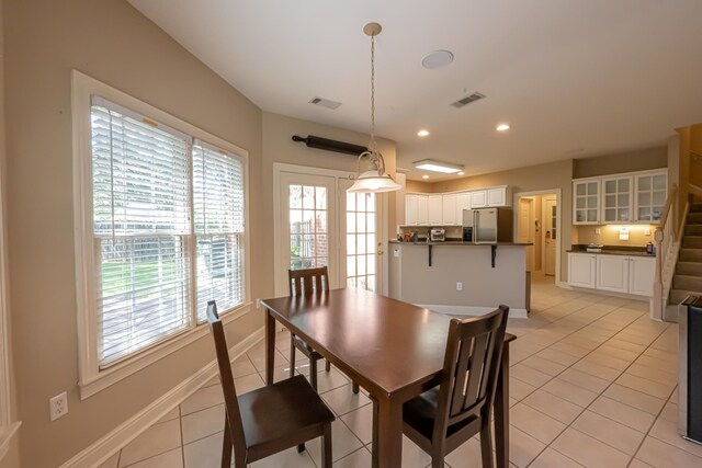 10223 Poston Oaks Cir, Collierville, TN 38017 - dining area featuring light tile patterned floors, baseboards, recessed lighting, and stairs