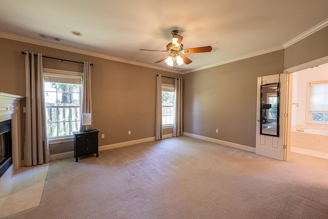 10223 Poston Oaks Cir, Collierville, TN 38017 - unfurnished living room with light carpet, plenty of natural light, ornamental molding, a fireplace with flush hearth, and a ceiling fan