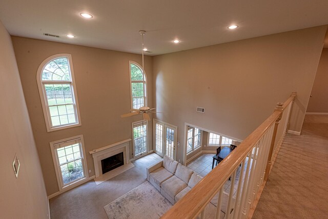 10223 Poston Oaks Cir, Collierville, TN 38017 - living area featuring carpet flooring, healthy amount of natural light, recessed lighting, baseboards, and a towering ceiling