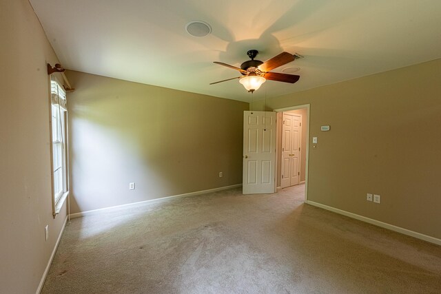 10223 Poston Oaks Cir, Collierville, TN 38017 - spare room with light carpet, ceiling fan, and baseboards