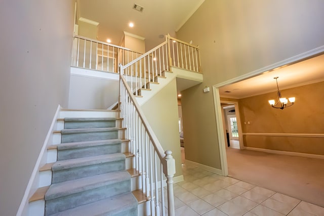 10223 Poston Oaks Cir, Collierville, TN 38017 - stairway featuring tile patterned floors, carpet flooring, a high ceiling, ornamental molding, and a chandelier