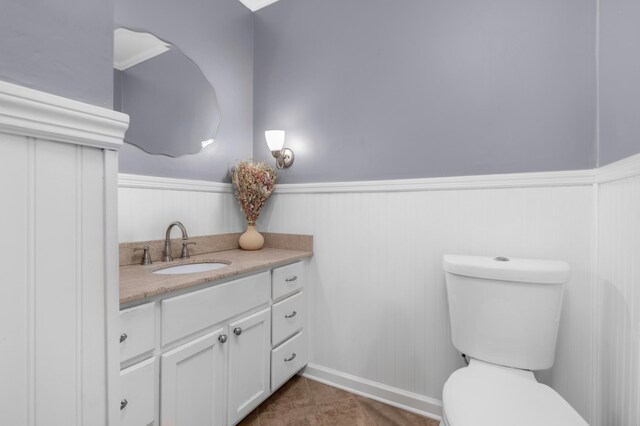 18 N Reese St, Memphis, TN 38111 - half bathroom with wainscoting, toilet, and vanity