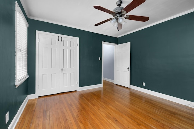 18 N Reese St, Memphis, TN 38111 - unfurnished bedroom with baseboards, wood-type flooring, a closet, ornamental molding, and ceiling fan