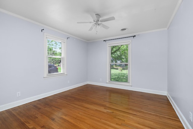 18 N Reese St, Memphis, TN 38111 - empty room featuring healthy amount of natural light, crown molding, wood finished floors, and baseboards