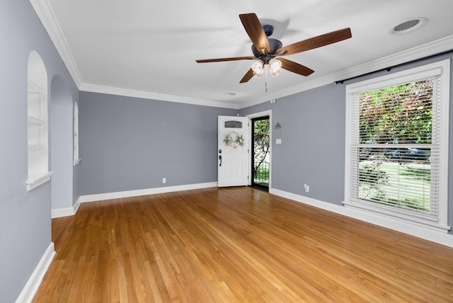 18 N Reese St, Memphis, TN 38111 - unfurnished room with wood finished floors, baseboards, arched walkways, a ceiling fan, and crown molding