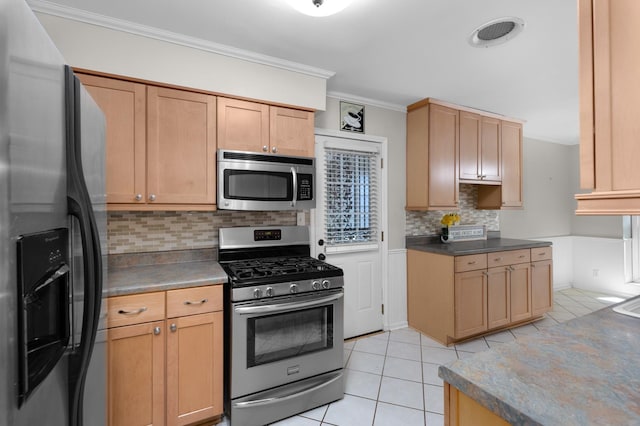 18 N Reese St, Memphis, TN 38111 - kitchen featuring appliances with stainless steel finishes, light tile patterned floors, tasteful backsplash, ornamental molding, and light brown cabinets