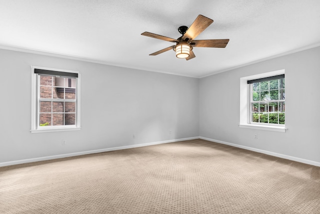 2349 Riverdale Rd, Germantown, TN 38138 - carpeted spare room featuring a ceiling fan, baseboards, and crown molding