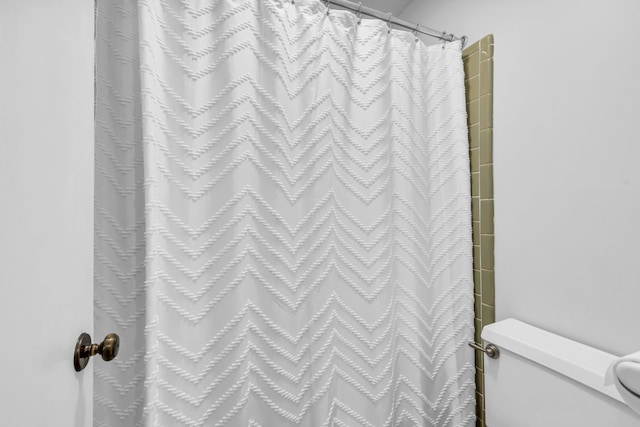 2349 Riverdale Rd, Germantown, TN 38138 - bathroom featuring toilet and a shower with shower curtain