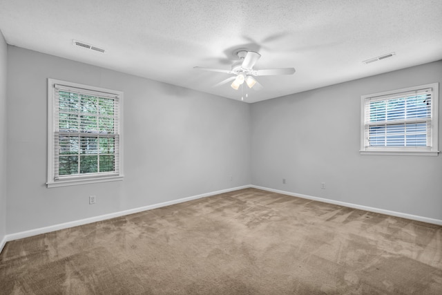 2349 Riverdale Rd, Germantown, TN 38138 - carpeted spare room with ceiling fan, baseboards, and a textured ceiling