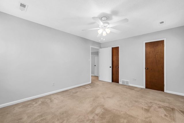2349 Riverdale Rd, Germantown, TN 38138 - unfurnished bedroom with carpet floors, baseboards, ceiling fan, and multiple closets
