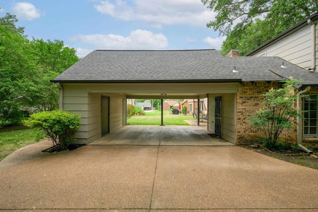2349 Riverdale Rd, Germantown, TN 38138 - garage with concrete driveway and a carport