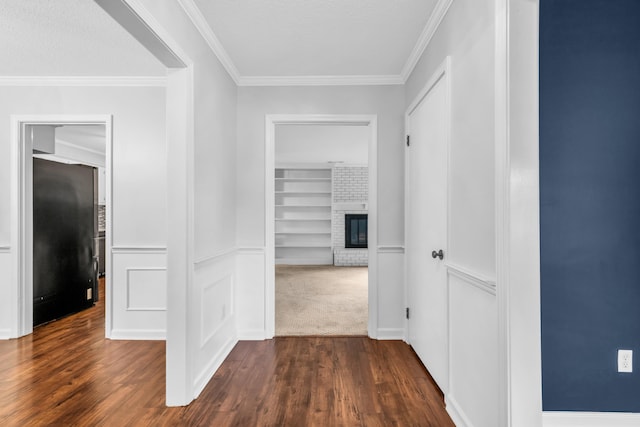 2349 Riverdale Rd, Germantown, TN 38138 - corridor with dark wood-type flooring, built in shelves, and ornamental molding