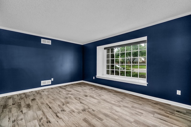 2349 Riverdale Rd, Germantown, TN 38138 - empty room featuring a textured ceiling, wood finished floors, crown molding, and baseboards