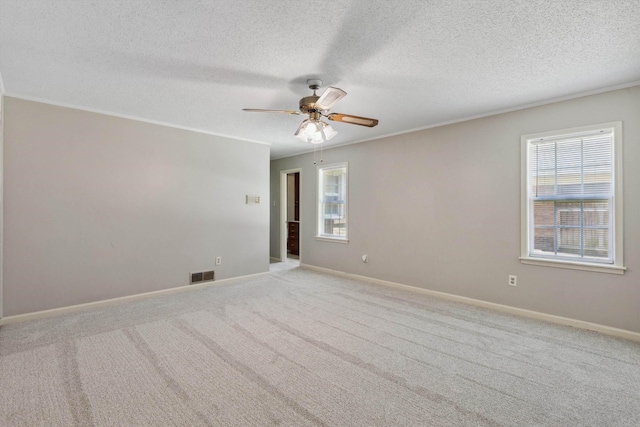 7617 Hollow Fork Rd, Germantown, TN 38138 - empty room with healthy amount of natural light, ceiling fan, a textured ceiling, crown molding, and baseboards