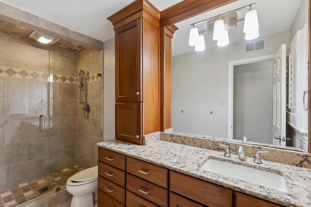7617 Hollow Fork Rd, Germantown, TN 38138 - bathroom featuring vanity, a shower stall, and toilet