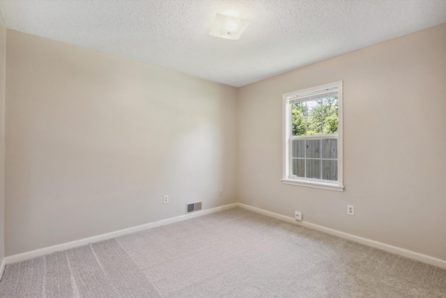 7617 Hollow Fork Rd, Germantown, TN 38138 - unfurnished room with carpet floors, a textured ceiling, and baseboards