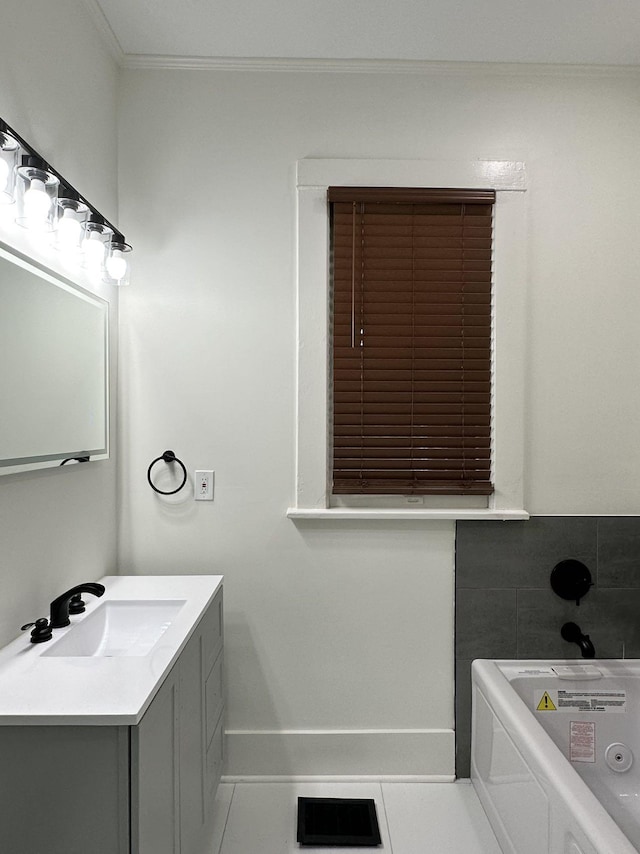 2038 Nelson Ave, Memphis, TN 38104 - bathroom with vanity, a whirlpool tub, baseboards, tile patterned floors, and crown molding