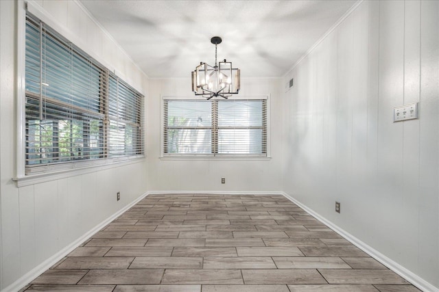 5796 N Foxburrow Cir, Memphis, TN 38115 - unfurnished room featuring a chandelier, ornamental molding, wood finished floors, and baseboards
