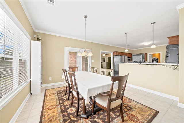 1166 Sanbyrn Dr, Cordova, TN 38018 - dining room featuring crown molding, light tile patterned floors, a chandelier, and baseboards