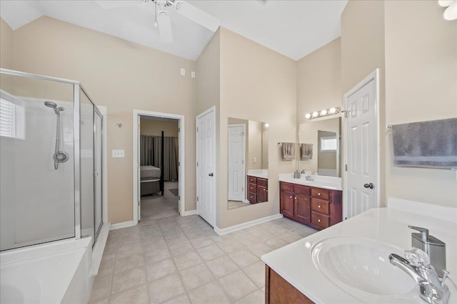 1166 Sanbyrn Dr, Cordova, TN 38018 - bathroom with a stall shower, two vanities, ceiling fan, high vaulted ceiling, and tile patterned flooring