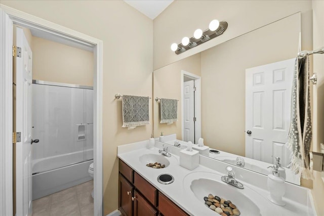 1166 Sanbyrn Dr, Cordova, TN 38018 - full bathroom featuring toilet, double vanity, tile patterned flooring, and bathing tub / shower combination