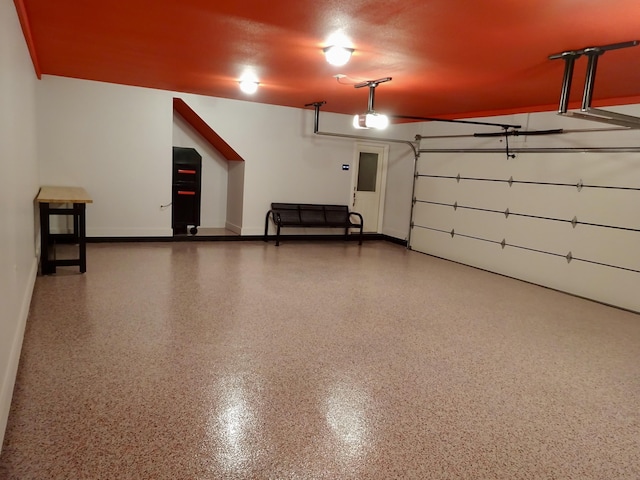 1166 Sanbyrn Dr, Cordova, TN 38018 - garage with baseboards and a garage door opener