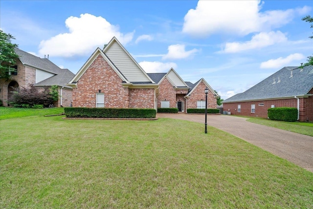 1166 Sanbyrn Dr, Cordova, TN 38018 - view of front facade featuring brick siding, a front lawn, and concrete driveway