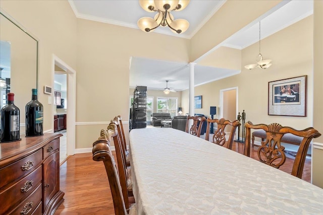 1166 Sanbyrn Dr, Cordova, TN 38018 - dining space with a chandelier, wood finished floors, ceiling fan, crown molding, and baseboards