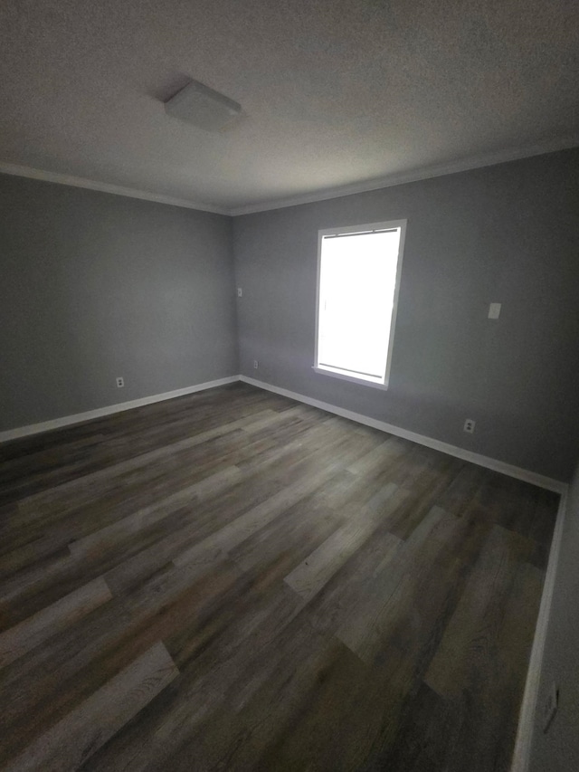 3989 Martindale Ave, Memphis, TN 38128 - empty room featuring crown molding, dark wood-style flooring, baseboards, and a textured ceiling
