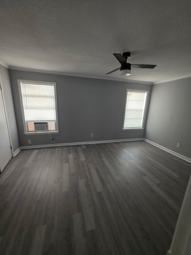 3989 Martindale Ave, Memphis, TN 38128 - empty room with dark wood finished floors, a textured ceiling, baseboards, a ceiling fan, and cooling unit