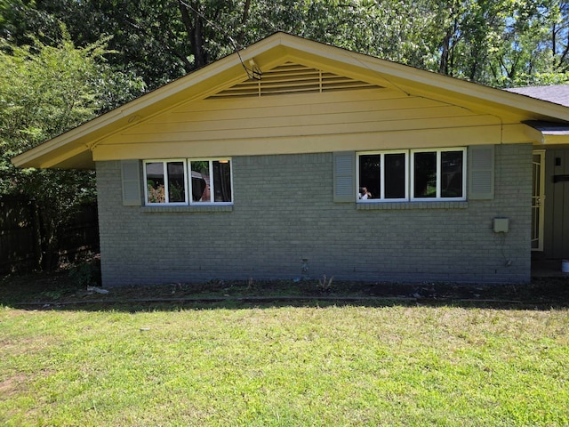 3989 Martindale Ave, Memphis, TN 38128 - view of side of home featuring brick siding and a lawn