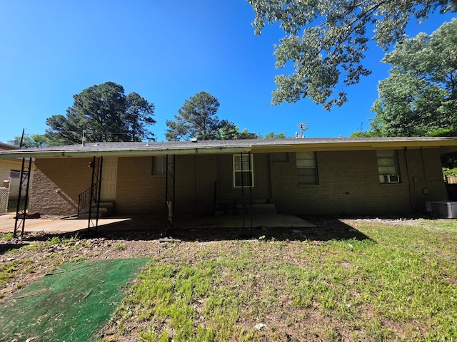 3989 Martindale Ave, Memphis, TN 38128 - back of house featuring a patio, brick siding, central AC, and a yard