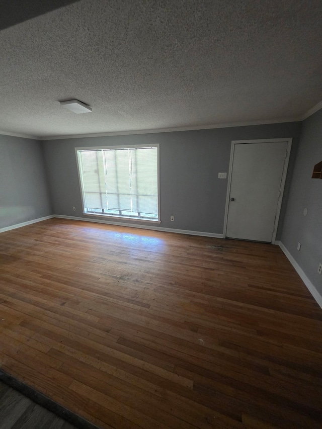 3989 Martindale Ave, Memphis, TN 38128 - empty room featuring wood finished floors, a textured ceiling, baseboards, and crown molding