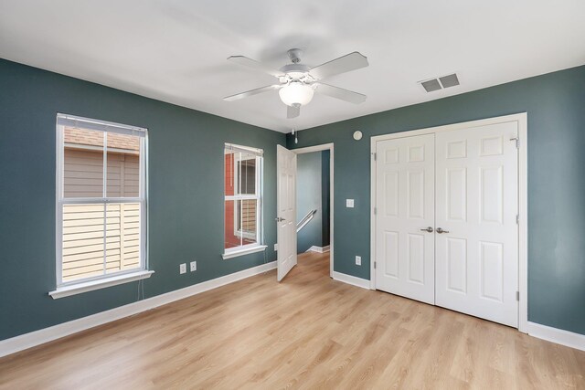 631 Peyton Cir, Memphis, TN 38107 - unfurnished bedroom featuring wood finished floors, baseboards, a closet, and a ceiling fan
