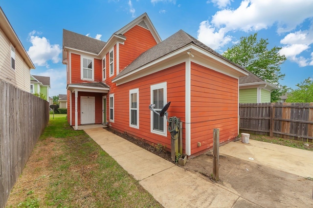 631 Peyton Cir, Memphis, TN 38107 - back of property featuring a patio area and a shingled roof