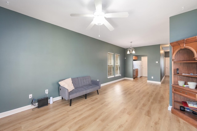 631 Peyton Cir, Memphis, TN 38107 - living area featuring light wood finished floors, a ceiling fan, baseboards, and a chandelier