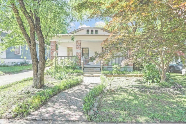 1995 Walker Ave, Memphis, TN 38104 - view of front of property featuring a porch and brick siding
