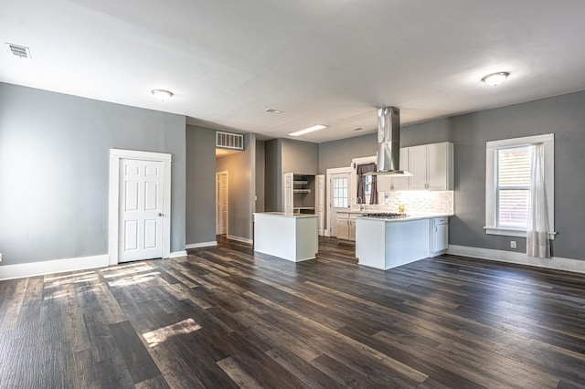2046 Courtland Pl, Memphis, TN 38104 - kitchen featuring island range hood, open floor plan, dark wood-style floors, and a peninsula