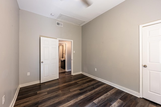 2046 Courtland Pl, Memphis, TN 38104 - unfurnished bedroom with attic access, dark wood finished floors, and baseboards