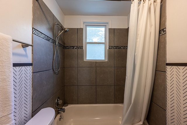 2046 Courtland Pl, Memphis, TN 38104 - bathroom with shower / bath combo, toilet, tile walls, and a wainscoted wall
