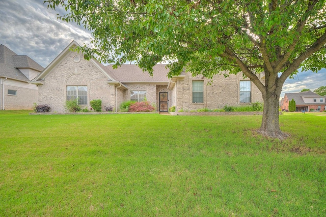 130 Pinehurst Dr, Oakland, TN 38060 - view of front facade featuring a front yard and brick siding