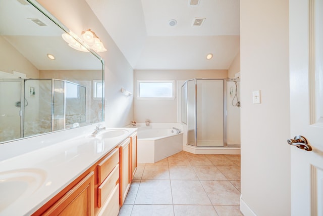 130 Pinehurst Dr, Oakland, TN 38060 - full bathroom with lofted ceiling, a garden tub, a shower stall, double vanity, and tile patterned flooring