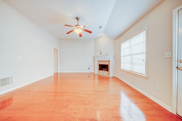 130 Pinehurst Dr, Oakland, TN 38060 - unfurnished living room with ceiling fan, light wood-type flooring, vaulted ceiling, a fireplace, and baseboards